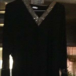 Neckline trimmed in gold